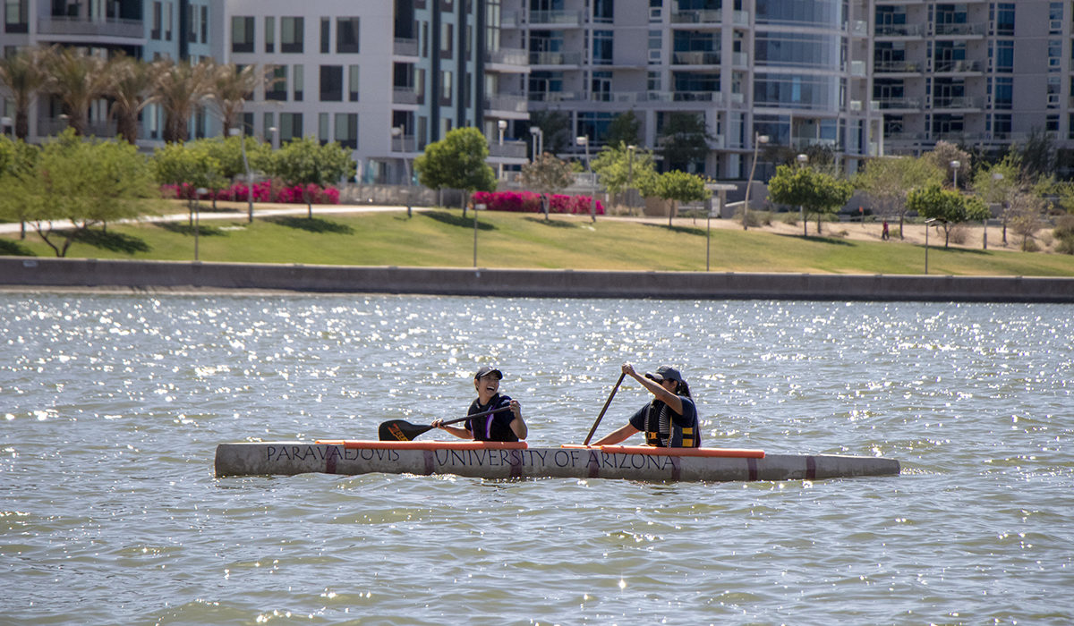 Photo of two people in a canoe. Caption: The ASCE event teaches students “the value of the spirit of competition,” said Emelia Park, a leader of the University of Southern California. “As much as we want to place highly, we also want to be the team that respects the rules and the teams we compete against.” Photographer: Marco-Alexis Chaira/ASU