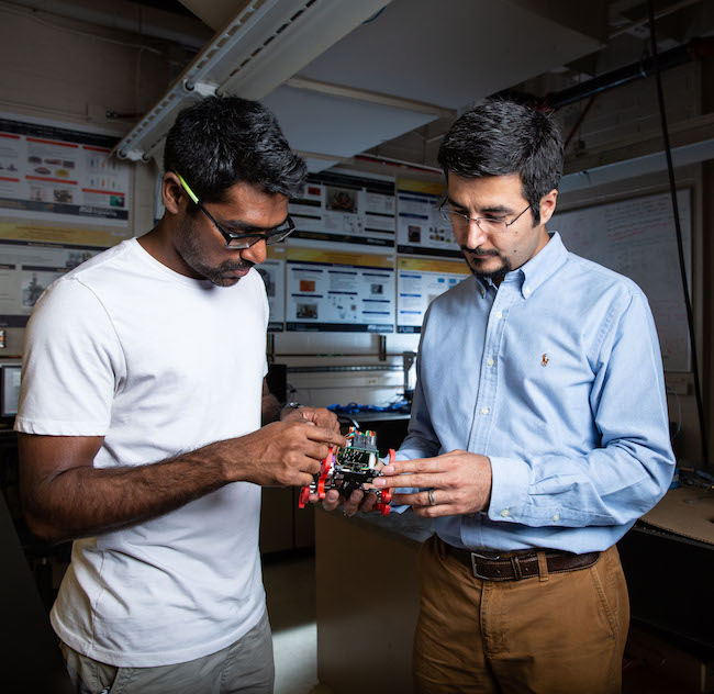 Two men standing in a lab