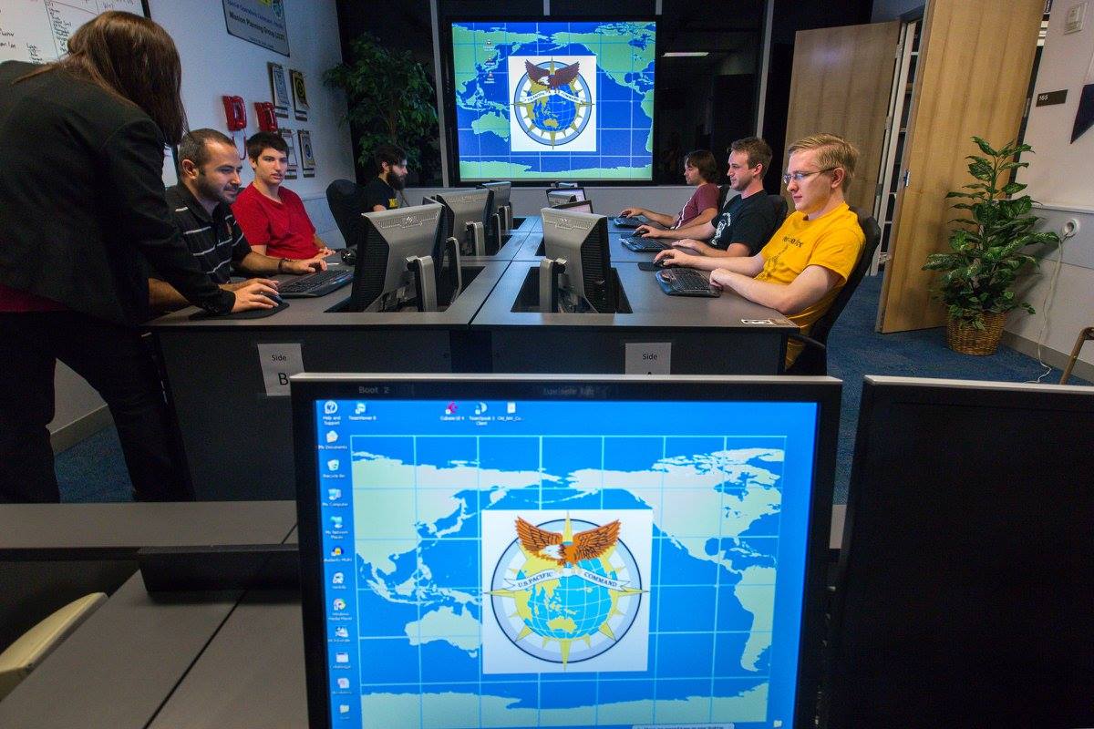 students seated around a large table
