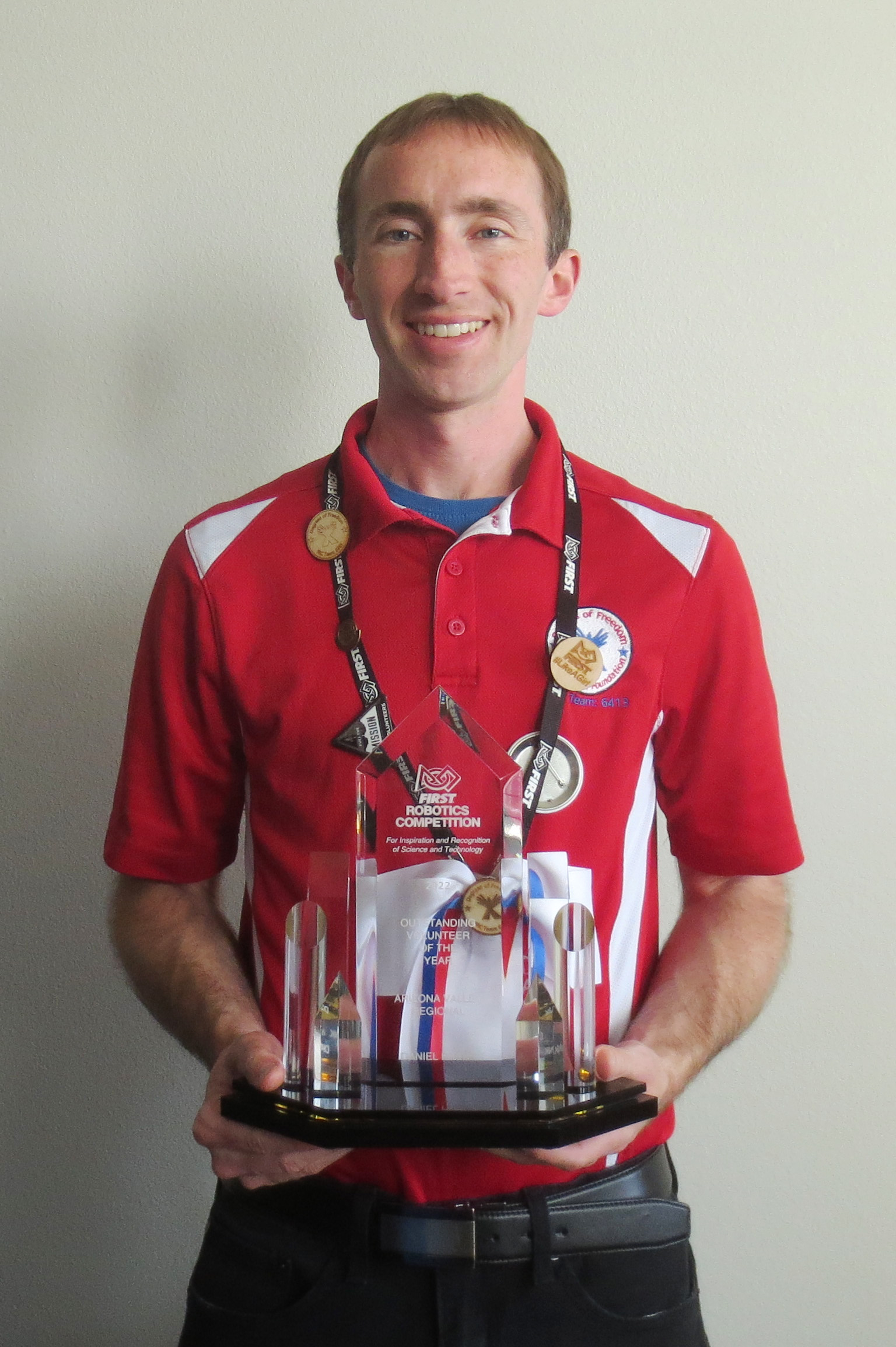 Daniel Frank holding a trophy