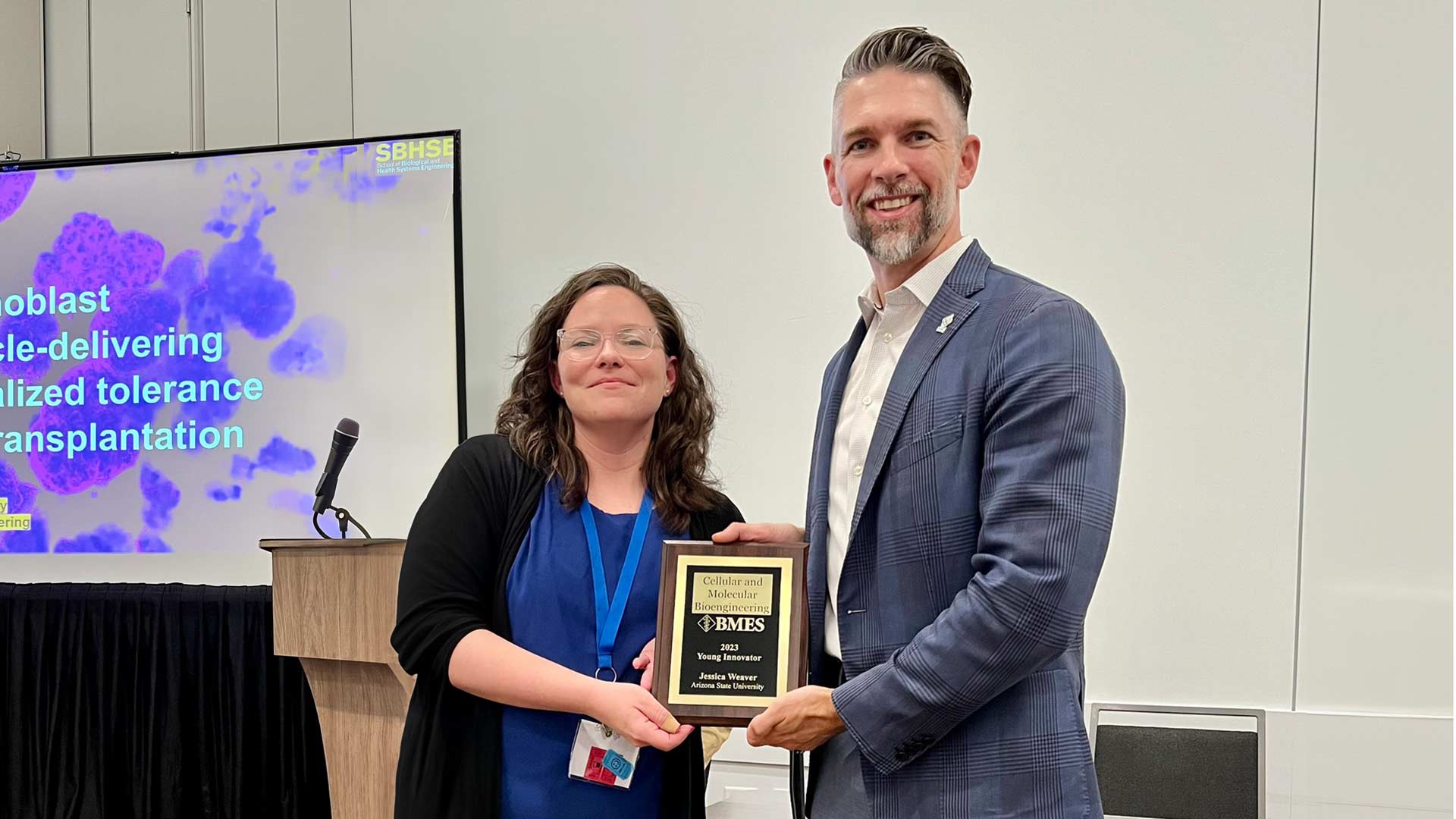 Jessica Weaver receiving at BMES Young Innovator Award